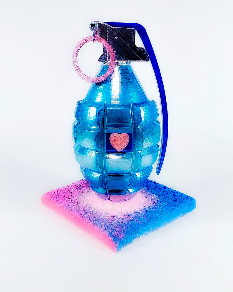 Inert Love sculpture by Jake Ashley – blue grenade with jeweled heart